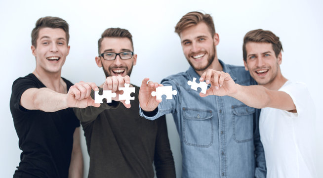 image of the guys connecting pieces of the puzzle