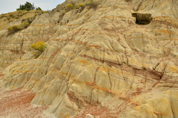 Erosion creates cracks and other interesting formations in badlands of North Dakota.