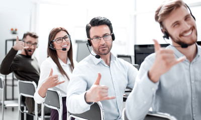 Fototapeta premium close up.smiling call center staff showing thumb up