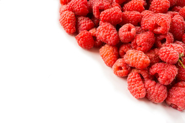 Background of raspberries. Fresh raspberries closeup on white background. Top view. Background of red berries. Various fresh summer fruits. Red raspberries. Red food.