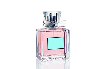 Pink perfume bottle on white background, close-up. Isolate.