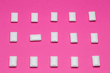 Chewing gum close up on a pink background