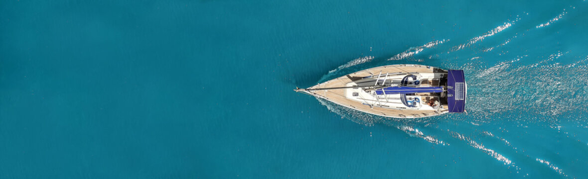 Beautiful photo of the yacht from above in the open sea.