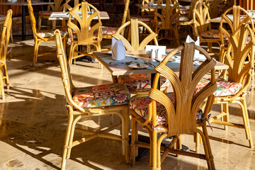 set  tables for breakfast in the hotel restaurant