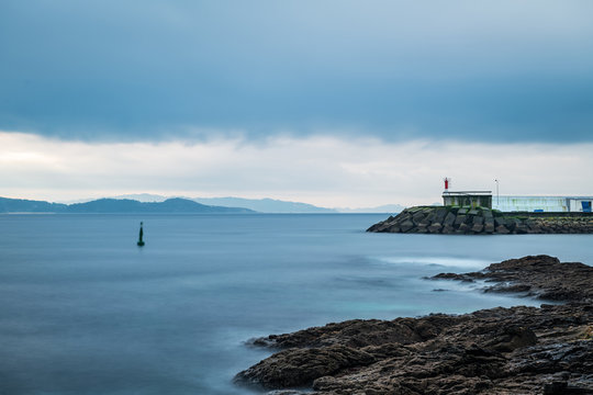 Cliffs and small lighthouse in Pontevedra, Spain