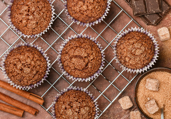 Chocolate muffins with Demerara sugar and cinnamon close-up. Selective focus