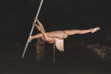 Woman practicing pole dance