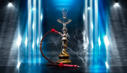 Smoking a hookah against a brick wall, concrete floor, blue  neon light, smoke