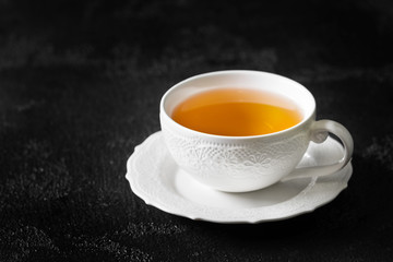 White Cup of tea on a black background