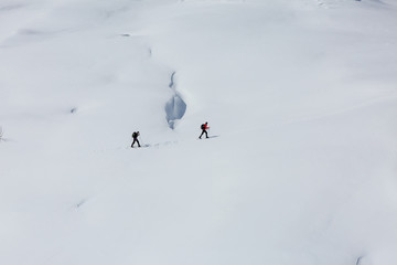 Tourists on slope of Alps