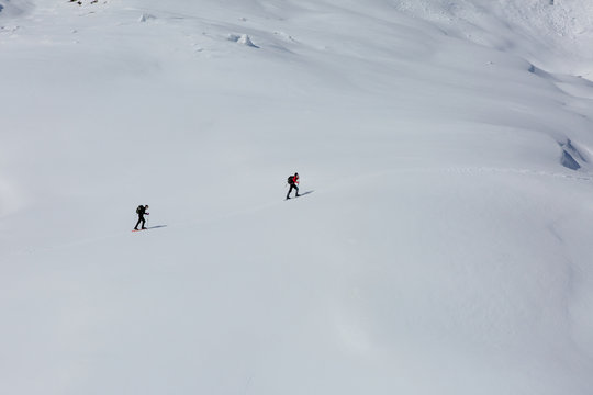 Tourists on slope of Alps