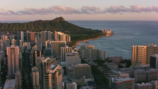 Honolulu, Oahu, Hawaii circa-2018.  Aerial view of Waikiki and Diamond Head at sunset.  Shot with Cineflex and RED Epic-W Helium. 