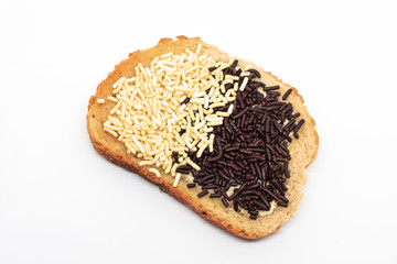 Delicious natural looking toast with Dutch chocolate sprinkles on isolated white background