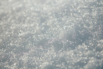 White winter snow snowflake shiny glow close up outdoor background