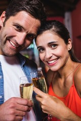 Couple enjoying champagne in nightclub
