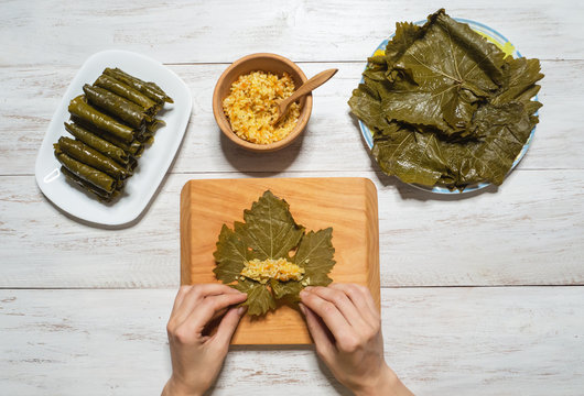 Stuffed Grape Leaves. Preparation of Dolma from grape leaves.
