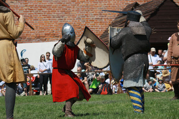 Knights fighting on tournament in Czersk castle, south of Warsaw, Mazovia, Poland - obrazy, fototapety, plakaty
