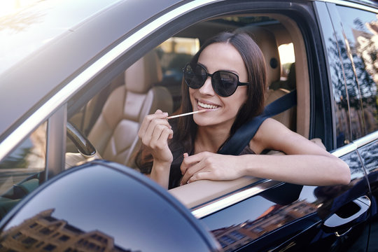 woman applying lips with lipstick