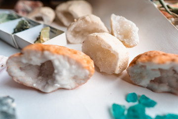 Collection of beautiful precious stones on white table.