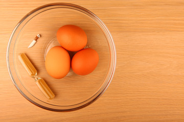 chicken eggs sand clock glass plate toy knife wooden table nobody 