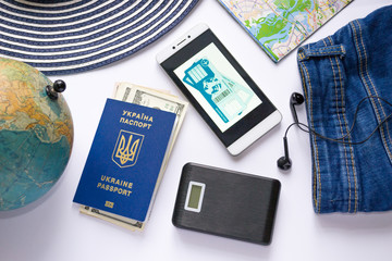 Airline tickets. Travel accessories. Tools for navigation. Ukrainian international biometric passport. Free visa law in Ukraine. Traveliing concept.