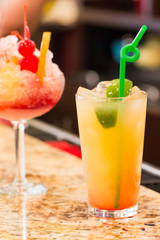 closeup of refreshing cocktails with restaurant background
