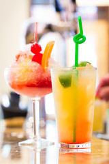 closeup of refreshing cocktails with restaurant background