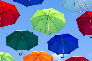 blue, white, red, yellow umbrellas