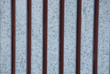 metal texture of brown iron bars on a gray wall