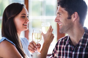 Couple having white wine in restaurant