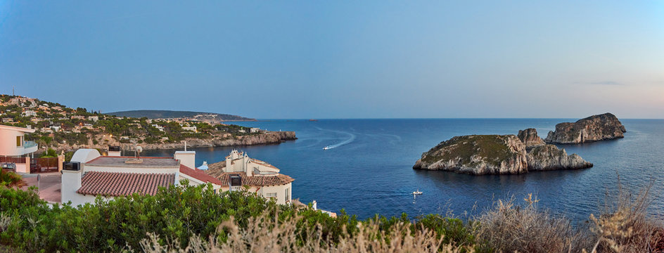 Spain. Mallorca. Santa Ponca. Panorama of the coast and Malgrat Islands in the shadow of the sunset