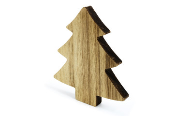 Tree shape cut out from wood as Christmas decoration with vintage look laid on white background