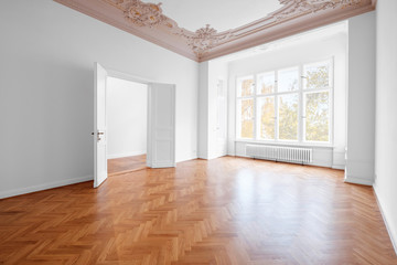 empty room, luxury apartment / flat in old building with wooden floor and stucco