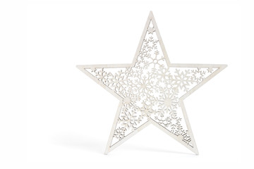 White star as Christmas decoration made and cut out with laser from wood