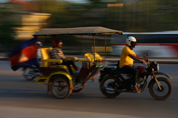 Siem Reap,Cambodia-Januay 13, 2019: A panning of motorcycle with trailer on National Highway 6 in Siem Reap, Cambodia