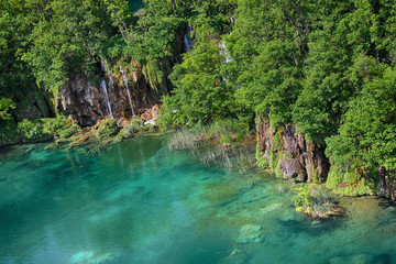 The beautiful view na the turquoise clear water of Plitvice lake.