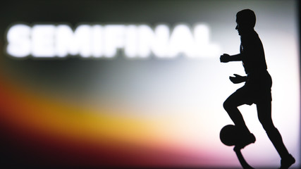 SEMIFINAL Tittle and Silhouette of Soccer player. Football photo, Edit space