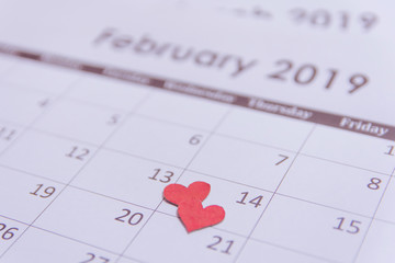 Valentines day greeting card. Red hearts paper on Calendar page February 14 with copy space