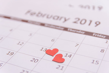 Valentines day greeting card. Red hearts paper on Calendar page February 14 with copy space