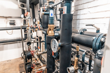 House heating system with many steel pipes, manometers and metal tubes