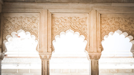 Islamic - Indian white marble columns and arches decorations inside palaces during Mughal empire. White palace exterior decorations at Agra Fort fortress in Agra, India.