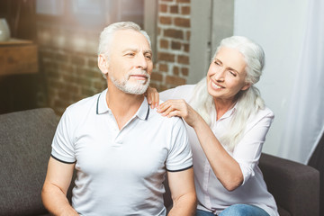 wife making shoulder massage for husband