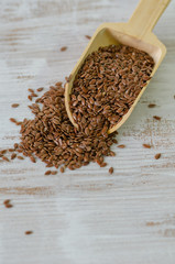 Flax seeds in wooden spoon
