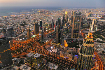 Blue hour cityscape of Dubai city centre with skyscrapers and lights, United Arab Emirates