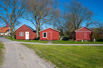 Fototapeta na wymiar Red fisherman's cottages near the harbor