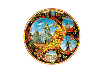 Fototapeta na wymiar ceramic souvenir toy in the form of plate with color painting on isolated white background reflecting the national Russian culture with the inscription in Russian: the name of the city of Belgorod