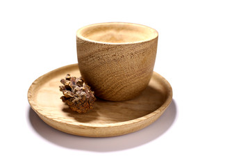 Wooden utensils as a blank, bowls, plates on a white background. The concept of the New Year holiday, healthy lifestyle. Texture of wood. Wooden environmental engineering