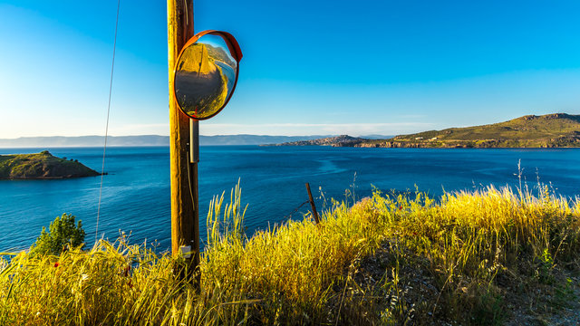 Island Lesbos, Molyvos, Greece - The coastal landscape in the north of the island of Lesbos, overlooking Molyvos with the castle, to the Turkish coast on a cloudless day in spring