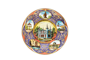 Obraz na płótnie Canvas ceramic souvenir toy in the form of plate with color painting on isolated white background reflecting the national Russian culture with the inscription in Russian: Lermontovskaya gallery Pyatigorsk
