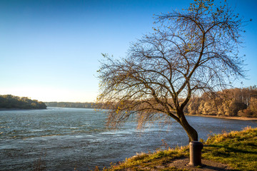 Fototapeta na wymiar River Danube flows through the autumn landscape.